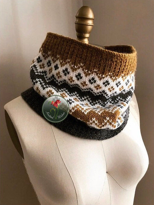 Knitted colorwork cowl on a mannequin with against a neutral background