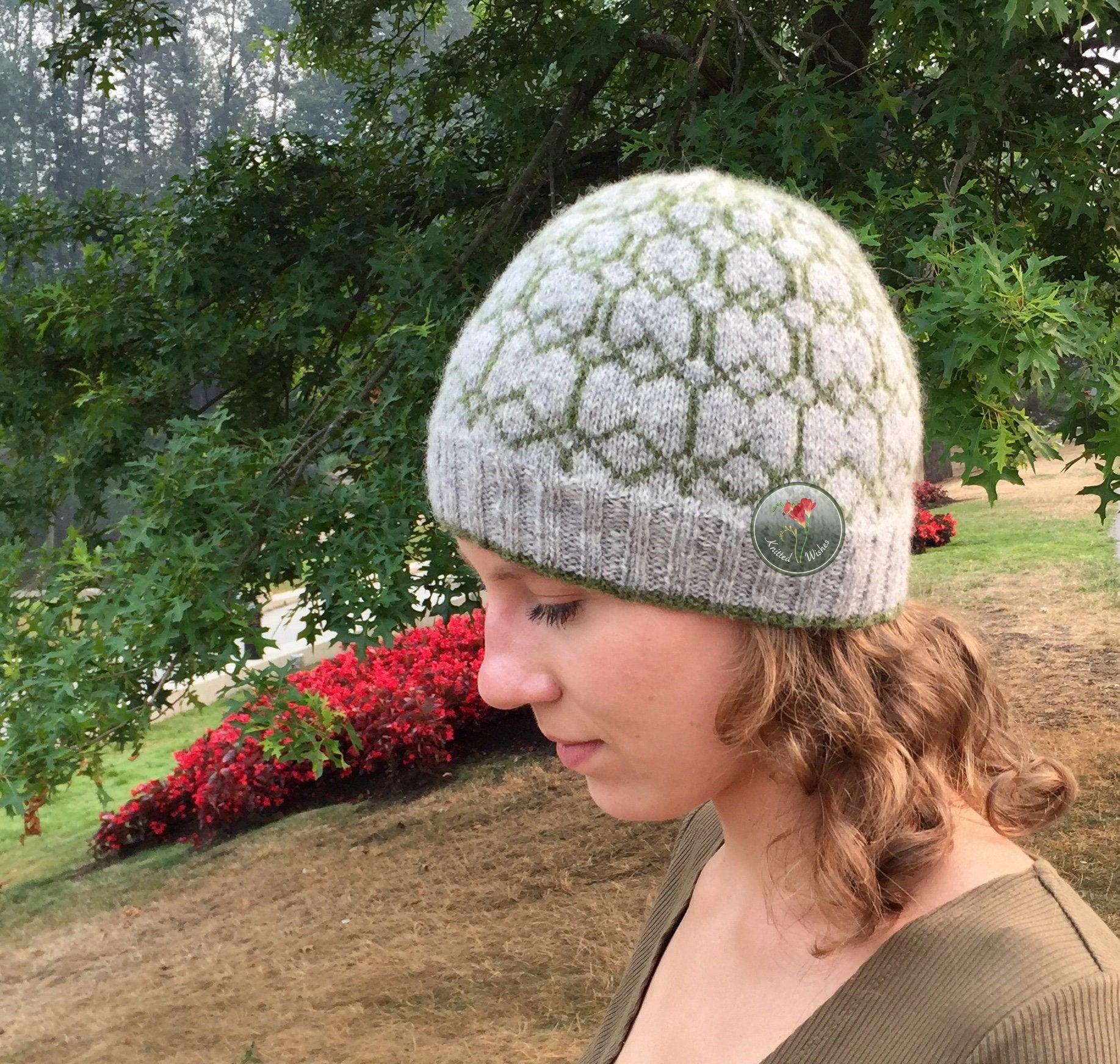 Person wearing a colorwork knit beanie in an outdoor setting