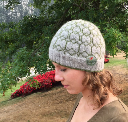 Person wearing a colorwork knit beanie in an outdoor setting