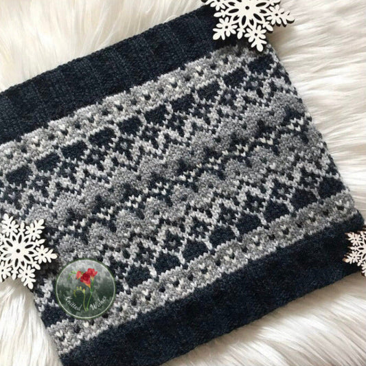 Knitted blanket with a geometric pattern on a white surface